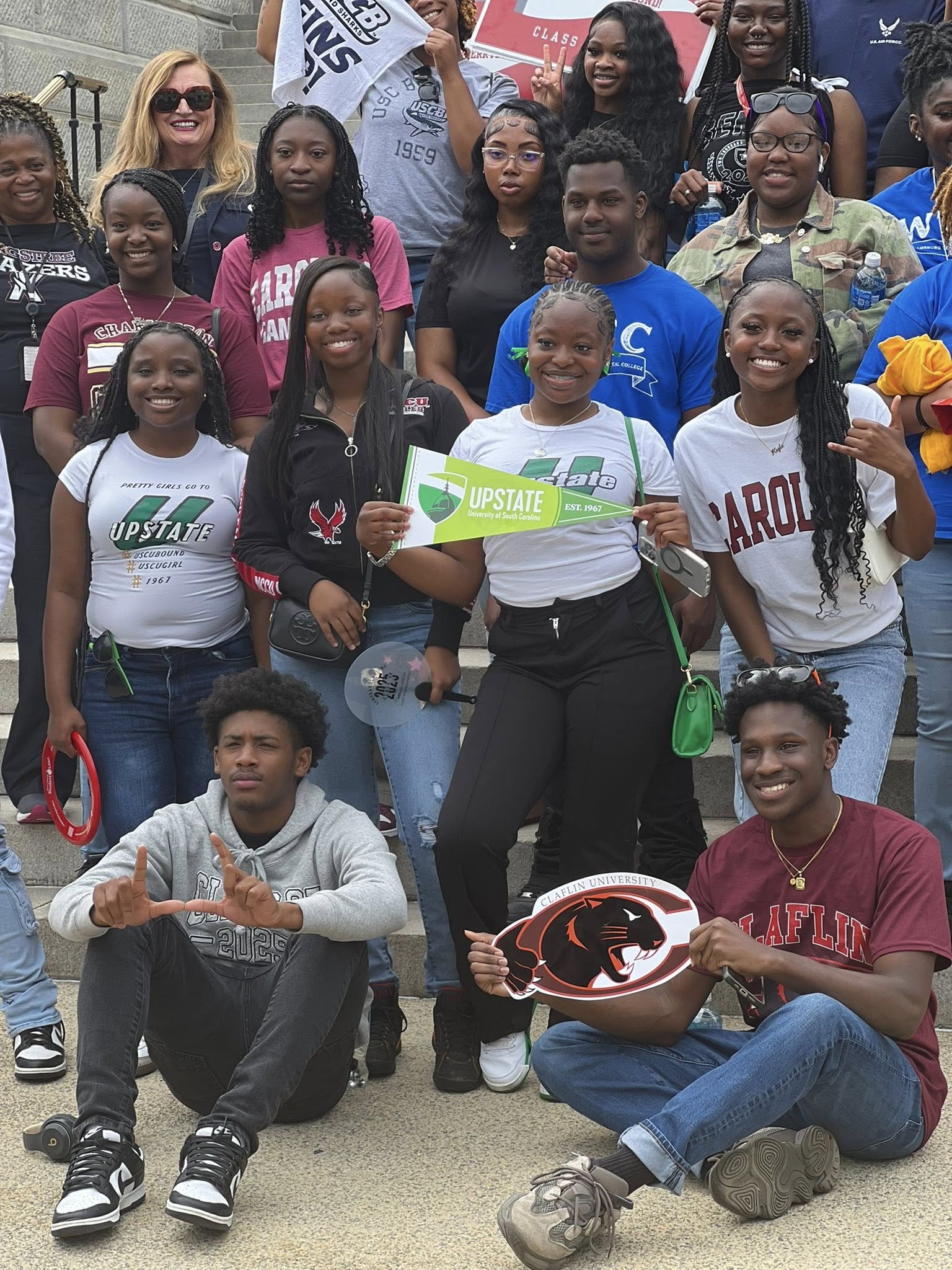 Students celebrate at the State House.