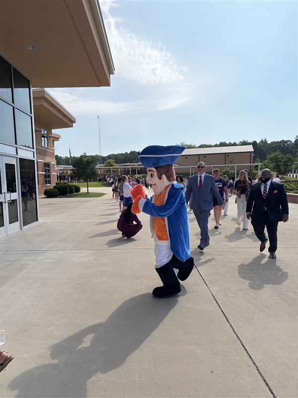 Students enter the event.